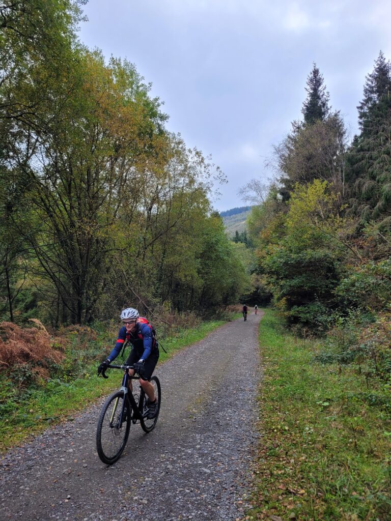 Jane ascending a fire road climb in the Garw Valley, Bridgend