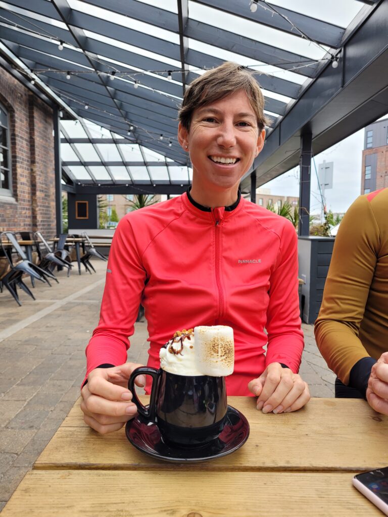 Sally enjoying a coffee on a club road ride